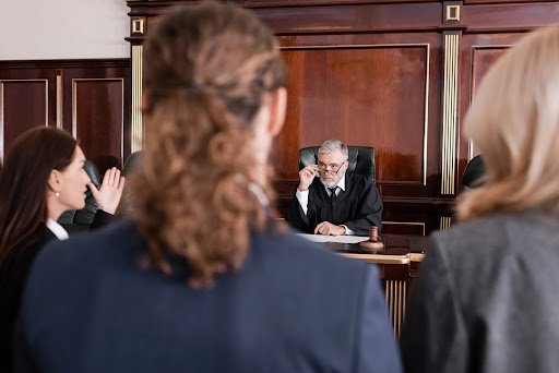 Why would a divorce go to trial? Counsel for both parties approach the bench to discuss disputed issues with the judge.